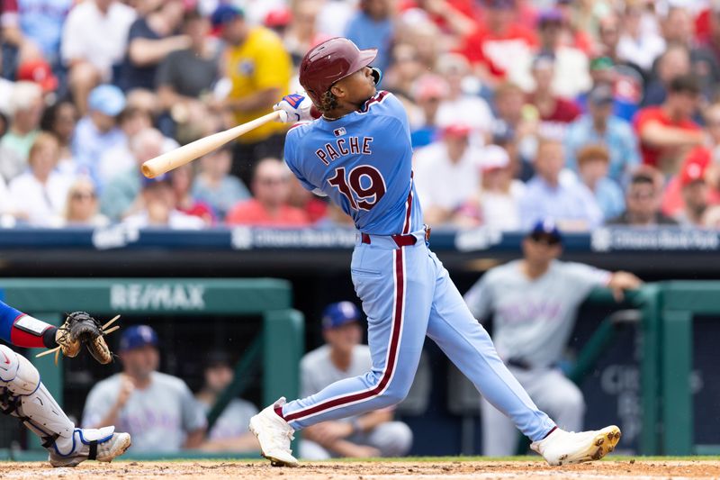 May 23, 2024; Philadelphia, Pennsylvania, USA; Philadelphia Phillies outfielder Cristian Pache (19) hits a two RBI triple during the fourth inning against the Texas Rangers at Citizens Bank Park. Mandatory Credit: Bill Streicher-USA TODAY Sports