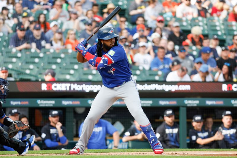 May 24, 2024; Detroit, Michigan, USA; Toronto Blue Jays first baseman Vladimir Guerrero Jr. (27) looks on during an at bat in the first inning of the game against the Detroit Tigers at Comerica Park. Mandatory Credit: Brian Bradshaw Sevald-USA TODAY Sports