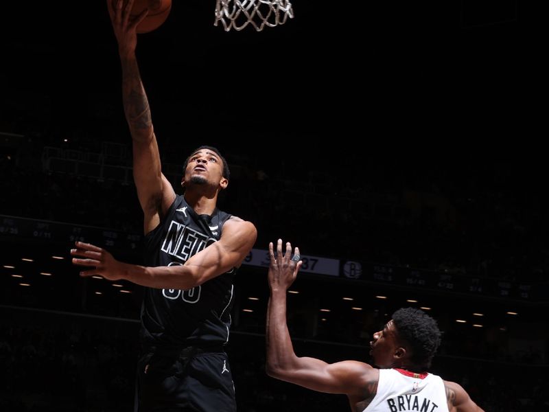 BROOKLYN, NY - JANUARY 15: Nicolas Claxton #33 of the Brooklyn Nets drives to the basket during the game against the Miami Heat on January 15, 2024 at Barclays Center in Brooklyn, New York. NOTE TO USER: User expressly acknowledges and agrees that, by downloading and or using this Photograph, user is consenting to the terms and conditions of the Getty Images License Agreement. Mandatory Copyright Notice: Copyright 2024 NBAE (Photo by Nathaniel S. Butler/NBAE via Getty Images)