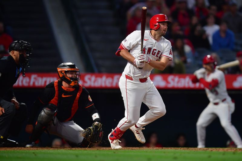Apr 23, 2024; Anaheim, California, USA; Los Angeles Angels first baseman Nolan Schanuel (18) hits an RBI single against the Baltimore Orioles during the fourth inning at Angel Stadium. Mandatory Credit: Gary A. Vasquez-USA TODAY Sports