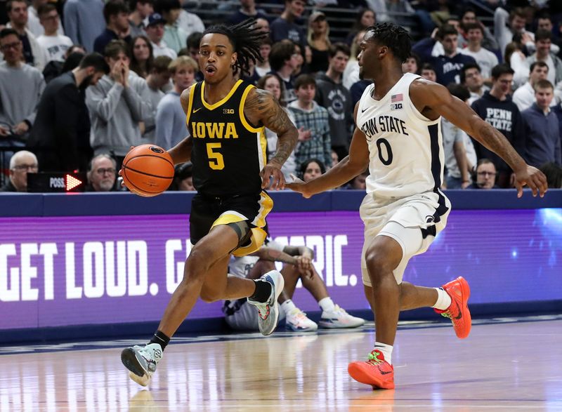 Feb 8, 2024; University Park, Pennsylvania, USA; Iowa Hawkeyes guard Dasonte Bowen (5) dribbles the ball up court as Penn State Nittany Lions guard Kanye Clary (0) defends during the second half at Bryce Jordan Center. Penn State defeated Iowa 89-79. Mandatory Credit: Matthew O'Haren-USA TODAY Sports