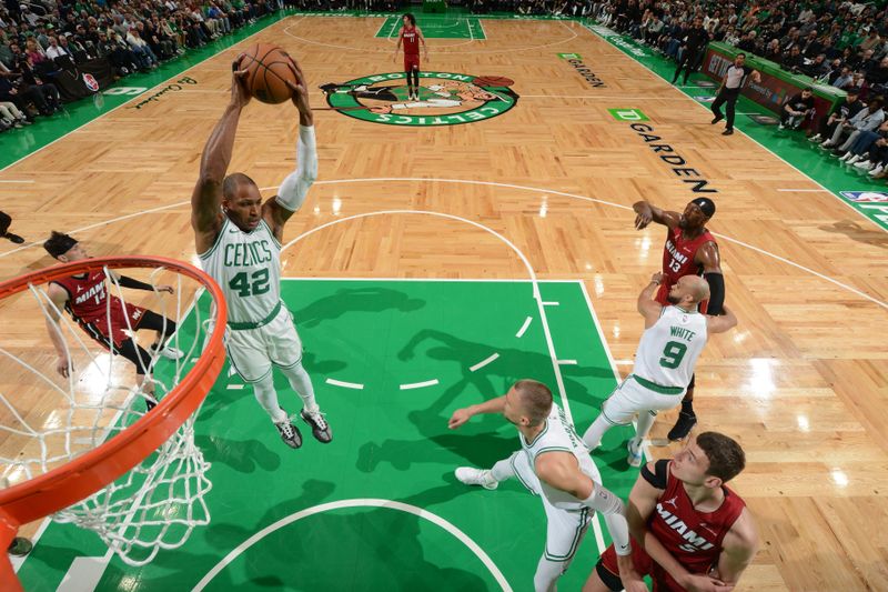 BOSTON, MA - APRIL 21: Al Horford #42 of the Boston Celtics grabs a rebound during the game against the Miami Heat during Round 1 Game 1 of the 2024 NBA Playoffs on April 21, 2024 at the TD Garden in Boston, Massachusetts. NOTE TO USER: User expressly acknowledges and agrees that, by downloading and or using this photograph, User is consenting to the terms and conditions of the Getty Images License Agreement. Mandatory Copyright Notice: Copyright 2024 NBAE  (Photo by Brian Babineau/NBAE via Getty Images)