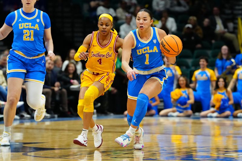 Mar 8, 2024; Las Vegas, NV, USA; UCLA Bruins guard Kiki Rice (1) dribbles against USC Trojans guard Kayla Williams (4) during the second quarter at MGM Grand Garden Arena. Mandatory Credit: Stephen R. Sylvanie-USA TODAY Sports