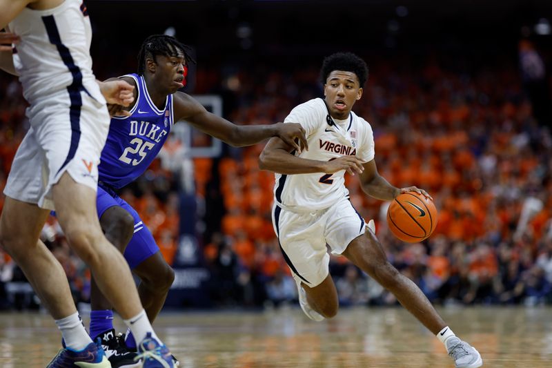 Feb 11, 2023; Charlottesville, Virginia, USA; Virginia Cavaliers guard Reece Beekman (2) drives to the basket as Duke Blue Devils forward Mark Mitchell (25) defends in the second half at John Paul Jones Arena. Mandatory Credit: Geoff Burke-USA TODAY Sports