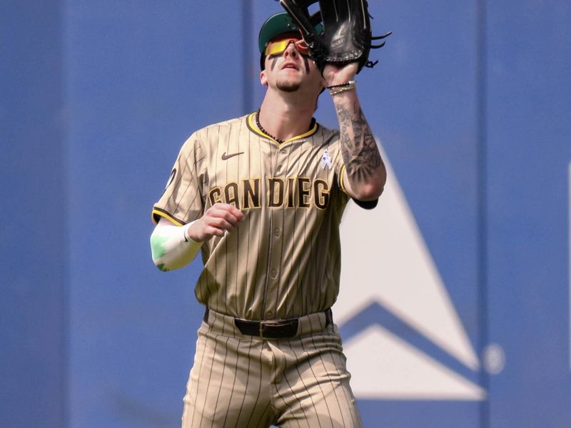 Jun 16, 2024; New York City, New York, USA; San Diego Padres outfielder Jackson Merrill (3) catches a fly ball for an out during the fourth inning against the New York Mets at Citi Field. Mandatory Credit: John Jones-USA TODAY Sports