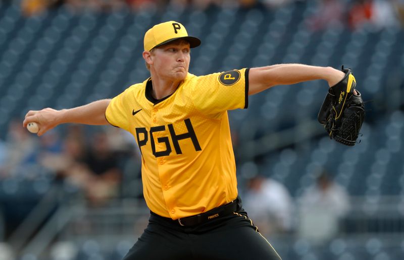 Jun 7, 2024; Pittsburgh, Pennsylvania, USA;  Pittsburgh Pirates starting pitcher Mitch Keller (23) delivers a pitch against the Minnesota Twins during the first inning at PNC Park. Mandatory Credit: Charles LeClaire-USA TODAY Sports