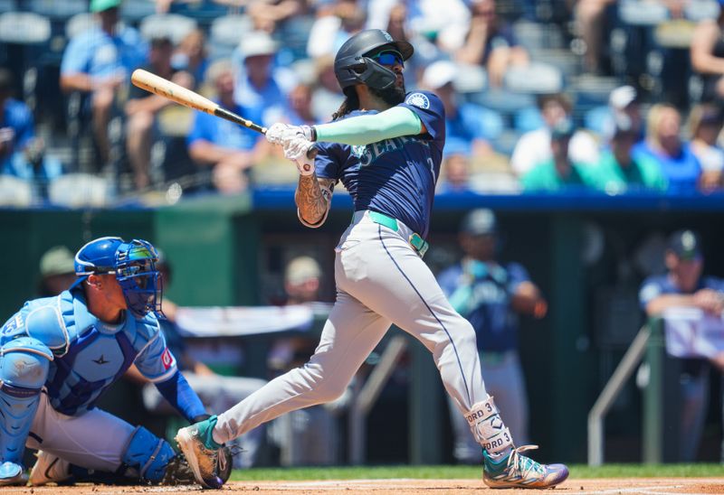 Jun 9, 2024; Kansas City, Missouri, USA; Seattle Mariners shortstop J.P. Crawford (3) hits a home run during the first inning against the Kansas City Royals at Kauffman Stadium. Mandatory Credit: Jay Biggerstaff-USA TODAY Sports