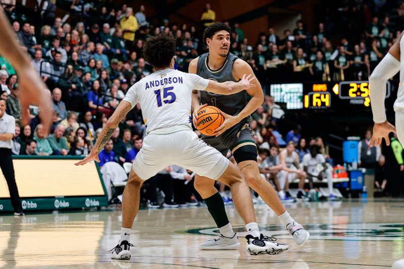 Feb 9, 2024; Fort Collins, Colorado, USA; Colorado State Rams forward Joel Scott (1) controls the ball as San Jose State Spartans forward Trey Anderson (15) guards in the second half at Moby Arena. Mandatory Credit: Isaiah J. Downing-USA TODAY Sports