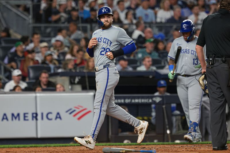 Sep 10, 2024; Bronx, New York, USA; Kansas City Royals center fielder Kyle Isbel (28) scores a run on a single by shortstop Bobby Witt Jr. (not pictured) during the third inning against the New York Yankees at Yankee Stadium. Mandatory Credit: Vincent Carchietta-Imagn Images