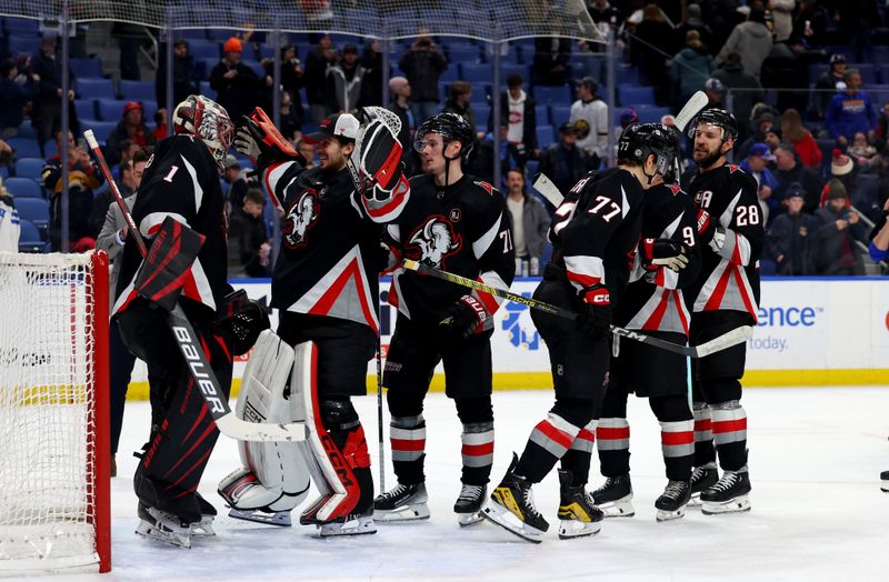 Jan 18, 2024; Buffalo, New York, USA;  Buffalo Sabres goaltender Ukko-Pekka Luukkonen (1) celebrates his shutout with teammates against the Chicago Blackhawks at KeyBank Center. Mandatory Credit: Timothy T. Ludwig-USA TODAY Sports