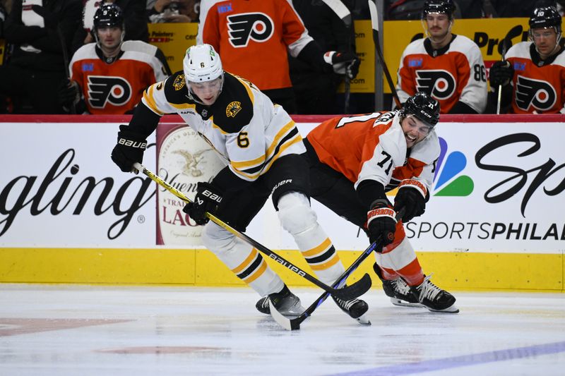 Nov 2, 2024; Philadelphia, Pennsylvania, USA; Boston Bruins defenseman Mason Lohrei (6) and Philadelphia Flyers right wing Tyson Foerster (71) battle for the puck in the second period at Wells Fargo Center. Mandatory Credit: Kyle Ross-Imagn Images