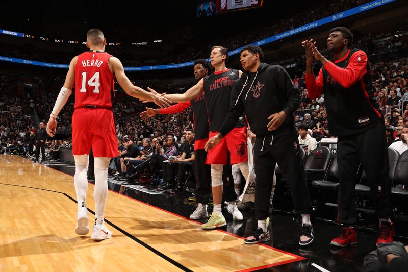 MIAMI, FL - NOVEMBER 24: Tyler Herro #14 of the Miami Heat celebrates with his teammates during the game against the Dallas Mavericks on November 24, 2024 at Kaseya Center in Miami, Florida. NOTE TO USER: User expressly acknowledges and agrees that, by downloading and or using this Photograph, user is consenting to the terms and conditions of the Getty Images License Agreement. Mandatory Copyright Notice: Copyright 2024 NBAE (Photo by Issac Baldizon/NBAE via Getty Images)