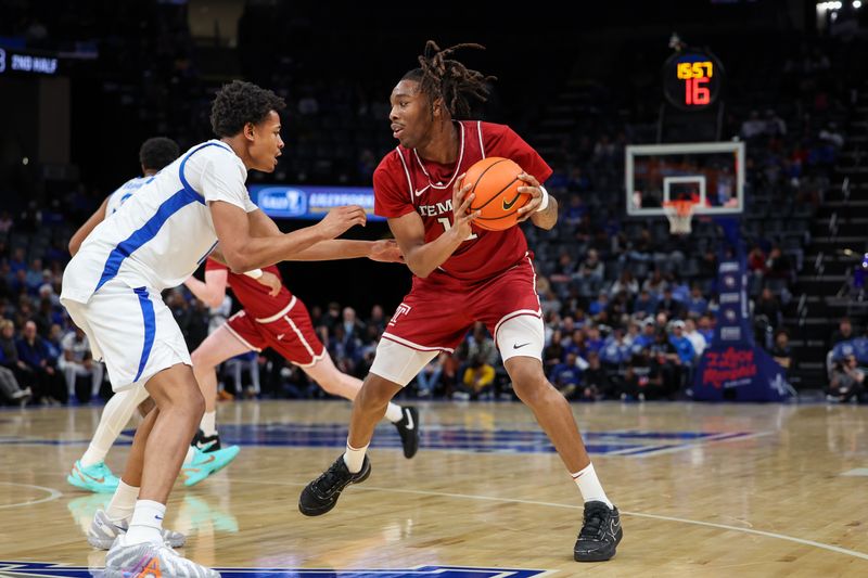 Jan 14, 2026; Memphis, Tennessee, USA; Temple Owls forward Babatunde Durodola (11) handles the ball against the Memphis Tigers during the second half at FedExForum. Mandatory Credit: Wesley Hale-Imagn Images
