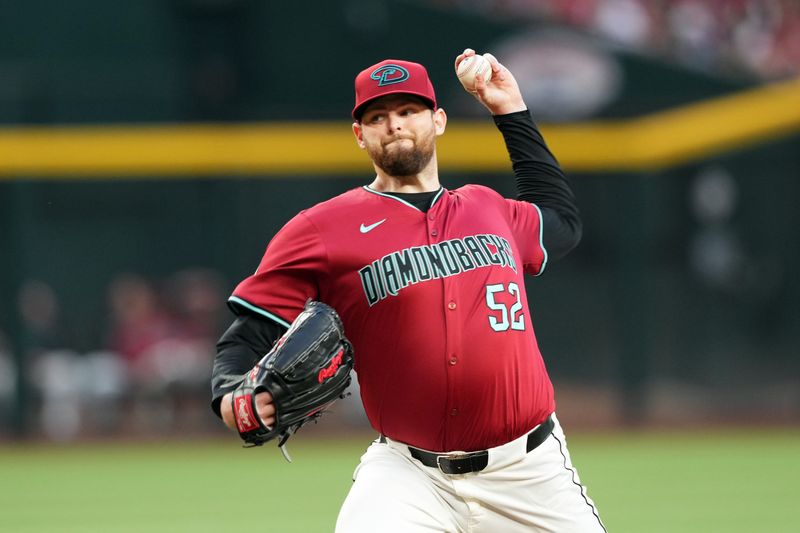 May 25, 2024; Phoenix, Arizona, USA; Arizona Diamondbacks pitcher Jordan Montgomery (52) pitches against the Miami Marlins during the first inning at Chase Field. Mandatory Credit: Joe Camporeale-USA TODAY Sports