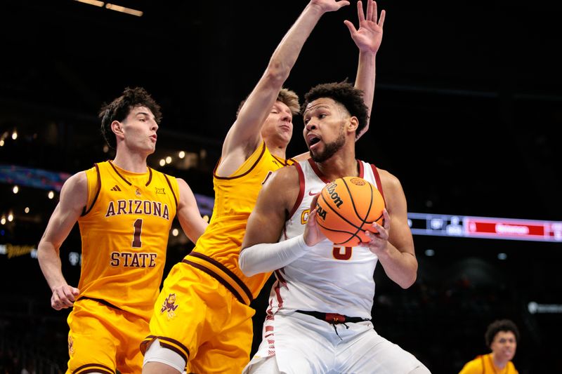 Mar 11, 2026; Kansas City, MO, USA; Iowa State Cyclones forward Joshua Jefferson (5) protects the ball during the first half against the Arizona State Sun Devils at T-Mobile Center. Mandatory Credit: William Purnell-Imagn Images