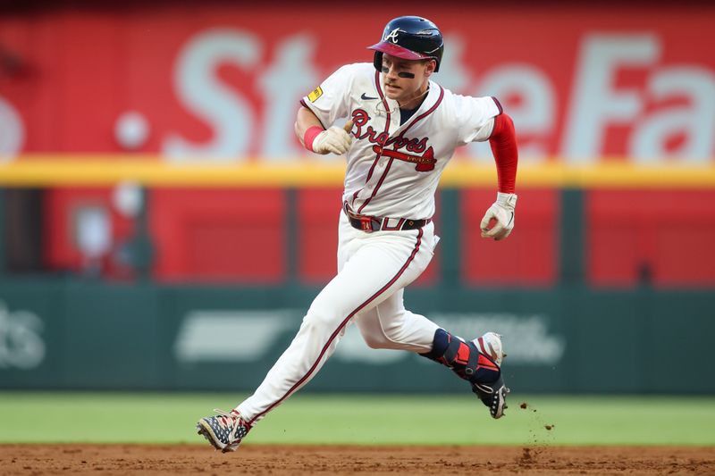 May 30, 2024; Atlanta, Georgia, USA; Atlanta Braves left fielder Jarred Kelenic (24) runs to third on a triple against the Washington Nationals in the third inning at Truist Park. Mandatory Credit: Brett Davis-USA TODAY Sports