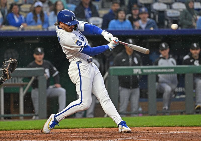 May 7, 2025; Kansas City, Missouri, USA;  Kansas City Royals shortstop Bobby Witt Jr. (7) hits a two-run home run in the fifth inning against the Chicago White Sox at Kauffman Stadium. Mandatory Credit: Peter Aiken-Imagn Images