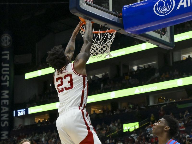 Mar 14, 2026; Nashville, TN, USA;  Arkansas Razorbacks forward Nick Pringle (23) dunks the ball against Mississippi during the first half at Bridgestone Arena. Mandatory Credit: Steve Roberts-Imagn Images
