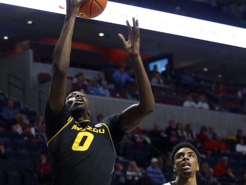 Jan 24, 2023; Oxford, Mississippi, USA; Missouri Tigers forward Mohamed Diarra (0) shoots during the first half against the Mississippi Rebels at The Sandy and John Black Pavilion at Ole Miss. Mandatory Credit: Petre Thomas-USA TODAY Sports