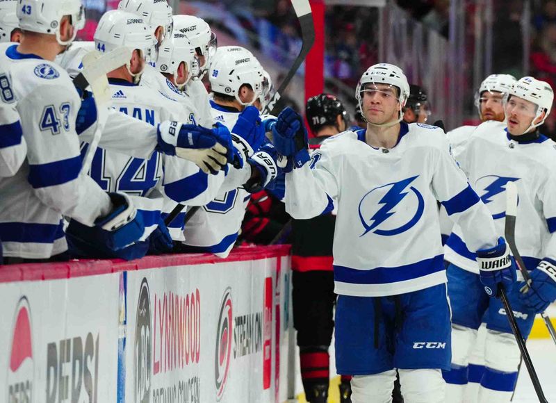 Nov 24, 2023; Raleigh, North Carolina, USA; Tampa Bay Lightning center Brayden Point (21) celebrates his goal against the Carolina Hurricanes during the third period  at PNC Arena. Mandatory Credit: James Guillory-USA TODAY Sports