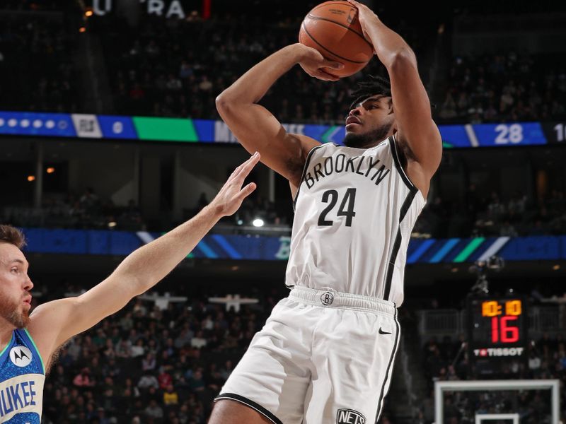 MILWAUKEE, WI - MARCH 21: Cam Thomas #24 of the Brooklyn Nets shoots the ball during the game against the Milwaukee Bucks on March 21, 2024 at the Fiserv Forum Center in Milwaukee, Wisconsin. NOTE TO USER: User expressly acknowledges and agrees that, by downloading and or using this Photograph, user is consenting to the terms and conditions of the Getty Images License Agreement. Mandatory Copyright Notice: Copyright 2024 NBAE (Photo by Gary Dineen/NBAE via Getty Images).