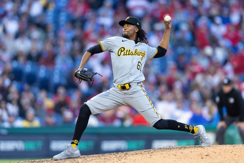 Apr 13, 2024; Philadelphia, Pennsylvania, USA; Pittsburgh Pirates pitcher Jose Hernandez (61) throws a pitch during the ninth inning against the Philadelphia Phillies at Citizens Bank Park. Mandatory Credit: Bill Streicher-USA TODAY Sports