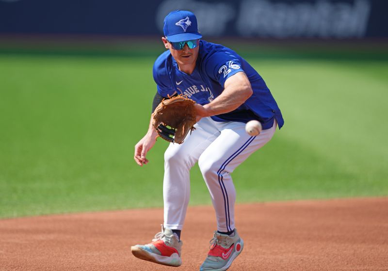 May 31, 2023; Toronto, Ontario, CAN; Toronto Blue Jays third baseman Matt Chapman (26) fields balls during batting practice against the Milwaukee Brewers at Rogers Centre. Mandatory Credit: Nick Turchiaro-USA TODAY Sports