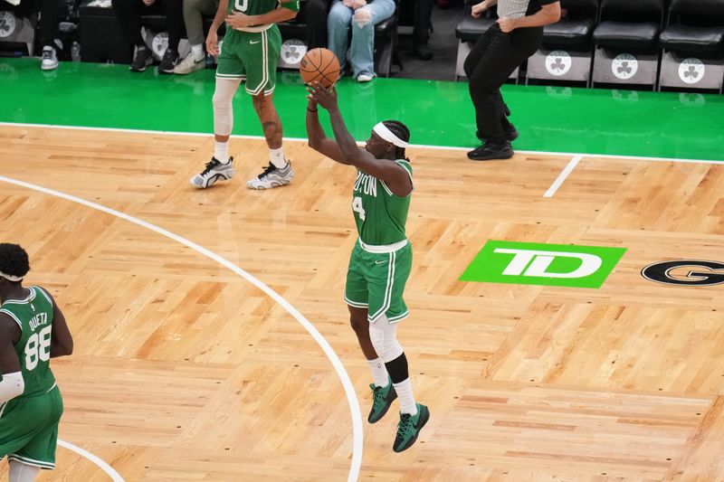 BOSTON, MA - NOVEMBER 6: Jrue Holiday #4 of the Boston Celtics shoots the ball during the game against the Golden State Warriors on November 6, 2024 at TD Garden in Boston, Massachusetts. NOTE TO USER: User expressly acknowledges and agrees that, by downloading and/or using this Photograph, user is consenting to the terms and conditions of the Getty Images License Agreement. Mandatory Copyright Notice: Copyright 2024 NBAE (Photo by Jesse D. Garrabrant/NBAE via Getty Images)