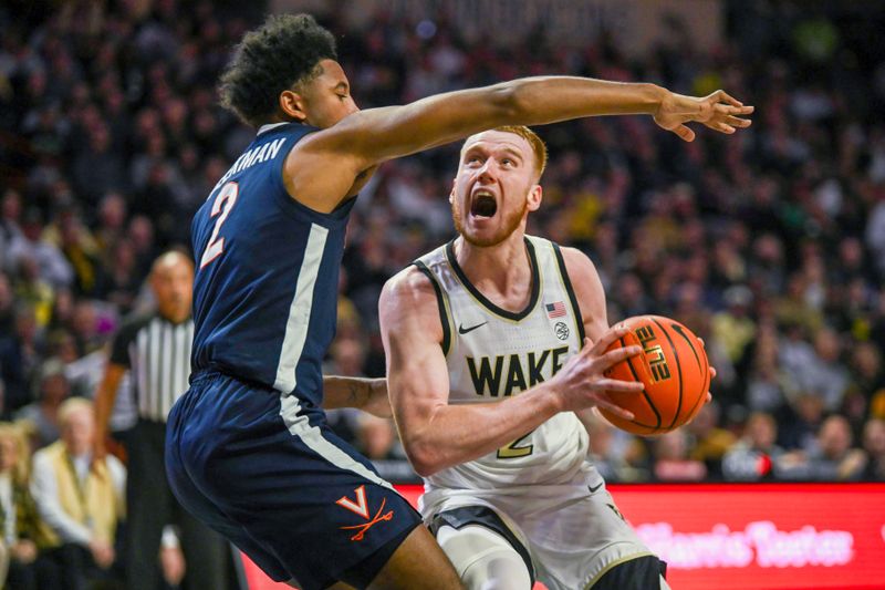 Jan 21, 2023; Winston-Salem, North Carolina, USA;  Wake Forest Demon Deacons guard Cameron Hildreth (2) posts for a shot against Virginia Cavaliers guard Reece Beekman (2) during the first half at Lawrence Joel Veterans Memorial Coliseum. Mandatory Credit: William Howard-USA TODAY Sports