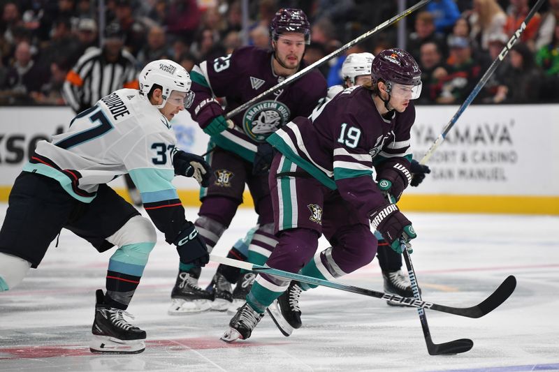 Dec 23, 2023; Anaheim, California, USA; Anaheim Ducks right wing Troy Terry (19) moves the puck against the Seattle Kraken during the second period at Honda Center. Mandatory Credit: Gary A. Vasquez-USA TODAY Sports