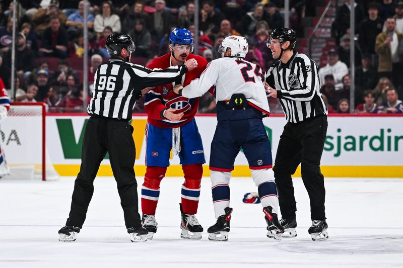 Nov 16, 2024; Montreal, Quebec, CAN; NHL linesman David Brisebois (96) and NHL linesman Ryan Gibbons (58) stop a fight between Montreal Canadiens defenseman Arber Xhekaj (72) and Columbus Blue Jackets right wing Mathieu Olivier (24)  during the second period at Bell Centre. Mandatory Credit: David Kirouac-Imagn Images