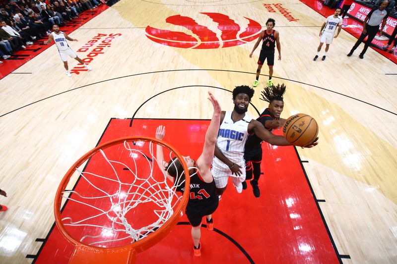 TORONTO, CANADA - JANUARY 3: Jonathan Isaac #1 of the Orlando Magic drives to the basket during the game against the Toronto Raptors on January 3, 2025 at the Scotiabank Arena in Toronto, Ontario, Canada.  NOTE TO USER: User expressly acknowledges and agrees that, by downloading and or using this Photograph, user is consenting to the terms and conditions of the Getty Images License Agreement.  Mandatory Copyright Notice: Copyright 2025 NBAE (Photo by Vaughn Ridley/NBAE via Getty Images)