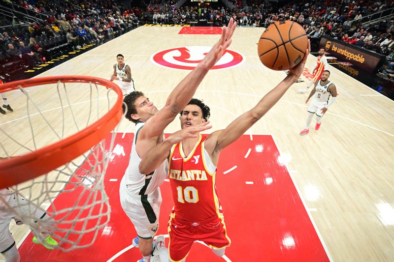 ATLANTA, GA - MARCH 4: Zaccharie Risacher #10 of the Atlanta Hawks drives to the basket during the game against the Milwaukee Bucks on March 4, 2025 at State Farm Arena in Atlanta, Georgia. NOTE TO USER: User expressly acknowledges and agrees that, by downloading and/or using this Photograph, user is consenting to the terms and conditions of the Getty Images License Agreement. Mandatory Copyright Notice: Copyright 2025 NBAE(Photo by Adam Hagy/NBAE via Getty Images)