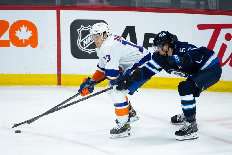 Jan 16, 2024; Winnipeg, Manitoba, CAN; New York Islanders forward Mathew Barzal (13) skates away from Winnipeg Jets defenseman Brenden Dillon (5) during the third period at Canada Life Centre. Mandatory Credit: Terrence Lee-USA TODAY Sports