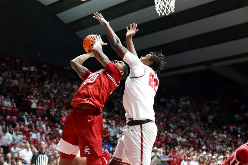 Feb 18, 2026; Tuscaloosa, Alabama, USA; Arkansas Razorback forward Nick Pringle (23) shoots against Alabama Crimson Tide forward Aiden Sherrell (22) during the first half at Coleman Coliseum. Mandatory Credit: David Leong-Imagn Images