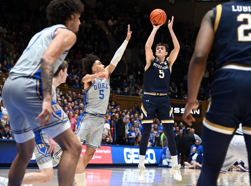 Feb 14, 2023; Durham, North Carolina, USA; Notre Dame Fighting Irish guard Cormac Ryan (5) shoots in front of Duke Blue Devils guard Tyrese Proctor(5) during the first half at Cameron Indoor Stadium. Mandatory Credit: Rob Kinnan-USA TODAY Sports