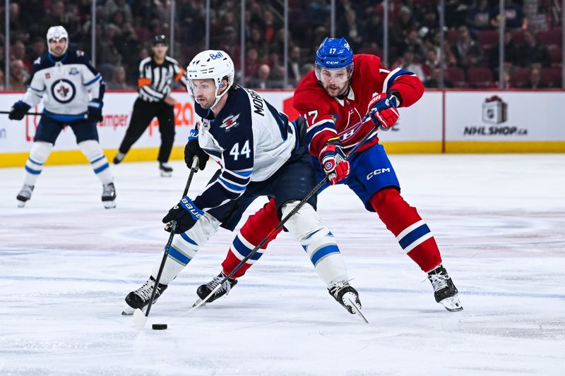 Dec 3, 2025; Montreal, Quebec, CAN; Montreal Canadiens right wing Josh Anderson (17) defends against Winnipeg Jets defenseman Josh Morrissey (44) during the second period at Bell Centre. Mandatory Credit: David Kirouac-Imagn Images