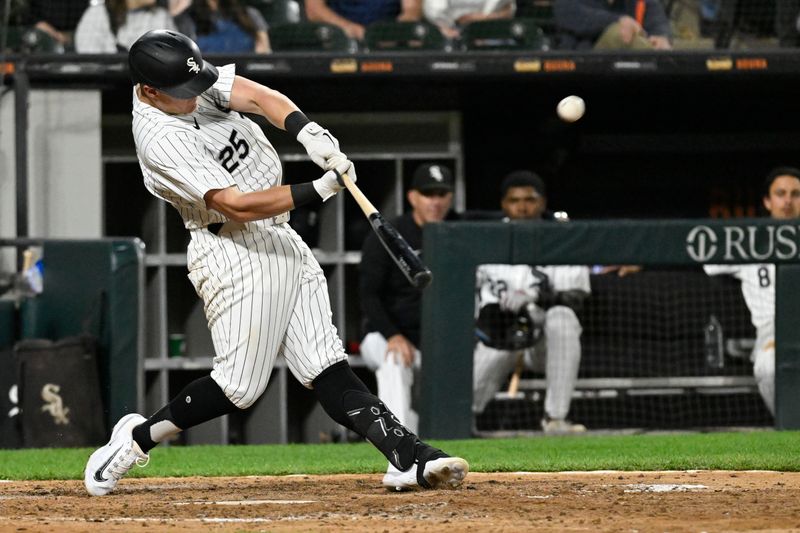 Jun 7, 2024; Chicago, Illinois, USA;  Chicago White Sox first base Andrew Vaughn (25) hits a home run against the Boston Red Sox during the sixth inning at Guaranteed Rate Field. Mandatory Credit: Matt Marton-USA TODAY Sports