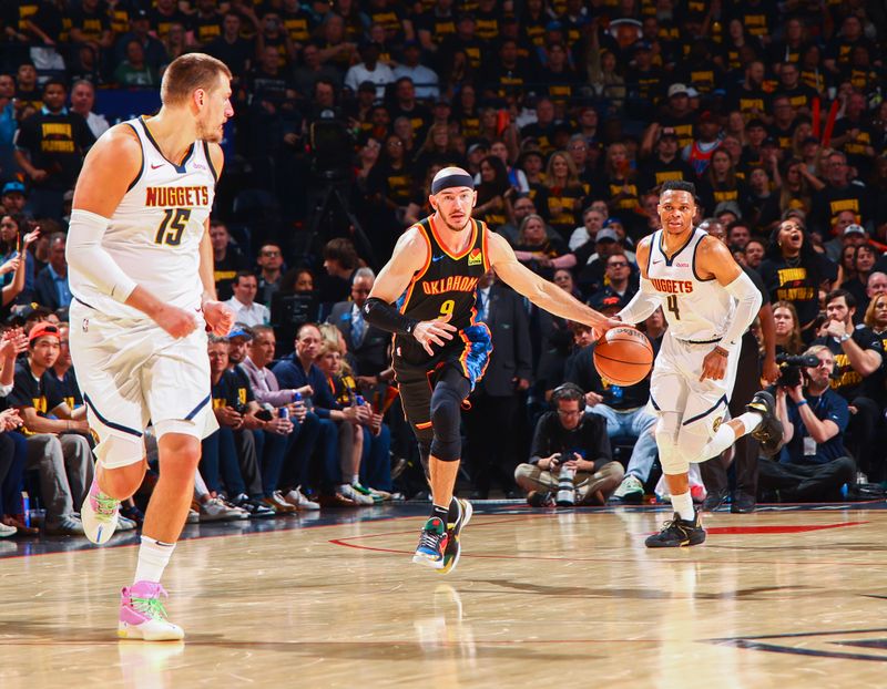 OKLAHOMA CITY, OK - MAY 7: Alex Caruso #9 of the Oklahoma City Thunder dribbles the ball during Round 2, Game 2 on May 7, 2025 against the Denver Nuggets at Paycom Center in Oklahoma City, Oklahoma. NOTE TO USER: User expressly acknowledges and agrees that, by downloading and or using this photograph, User is consenting to the terms and conditions of the Getty Images License Agreement. Mandatory Copyright Notice: Copyright 2024 NBAE (Photo by Zach Beeker/NBAE via Getty Images)