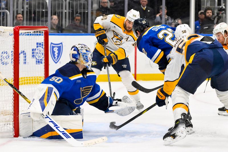 Mar 23, 2025; St. Louis, Missouri, USA;  Nashville Predators center Ryan O'Reilly (90) shoots against St. Louis Blues goaltender Jordan Binnington (50) during the third period at Enterprise Center. Mandatory Credit: Jeff Curry-Imagn Images