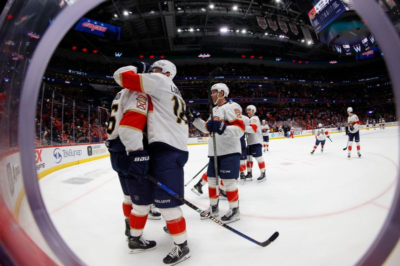 Nov 8, 2023; Washington, District of Columbia, USA; Florida Panthers players celebrate after a game winning goal by Florida Panthers center Sam Reinhart (not pictured) against the Washington Capitals at Capital One Arena. Mandatory Credit: Geoff Burke-USA TODAY Sports