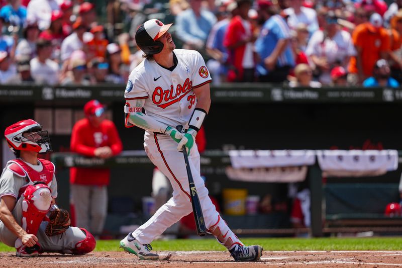 Jun 16, 2024; Baltimore, Maryland, USA; Baltimore Orioles catcher Adley Rutschman (35) watches his home run against the Philadelphia Phillies during the third inning at Oriole Park at Camden Yards. Mandatory Credit: Gregory Fisher-USA TODAY Sports