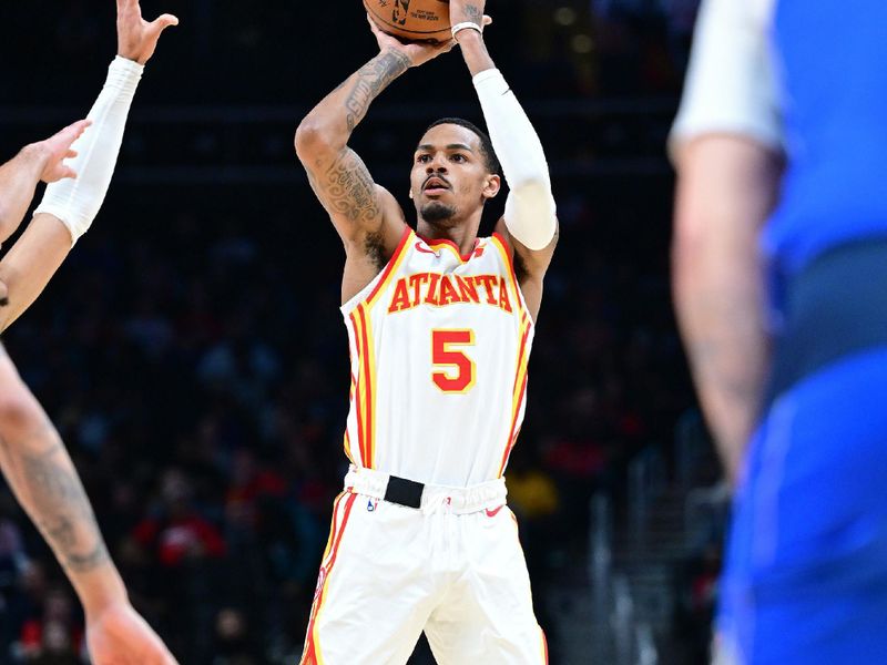 ATLANTA, GA - JANUARY 26: Dejounte Murray #5 of the Atlanta Hawks three point basket during the game against the Dallas Mavericks on January 26, 2024 at State Farm Arena in Atlanta, Georgia.  NOTE TO USER: User expressly acknowledges and agrees that, by downloading and/or using this Photograph, user is consenting to the terms and conditions of the Getty Images License Agreement. Mandatory Copyright Notice: Copyright 2024 NBAE (Photo by Adam Hagy/NBAE via Getty Images)