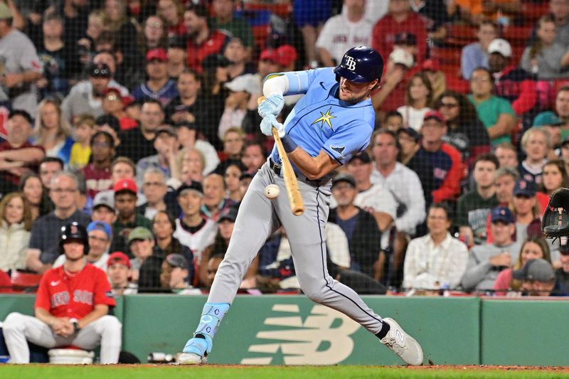 Sep 27, 2024; Boston, Massachusetts, USA; Tampa Bay Rays right fielder Josh Lowe (15) hits a double against the Boston Red Sox during the fifth inning at Fenway Park. Mandatory Credit: Eric Canha-Imagn Images