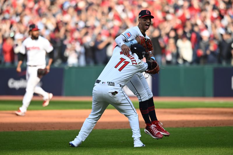 Oct 12, 2024; Cleveland, Ohio, USA; Cleveland Guardians third base José Ramírez (11) celebrates with shortstop Brayan Rocchio (4) after defeating the Detroit Tigers during game five of the ALDS for the 2024 MLB Playoffs at Progressive Field. Mandatory Credit: Ken Blaze-Imagn Images