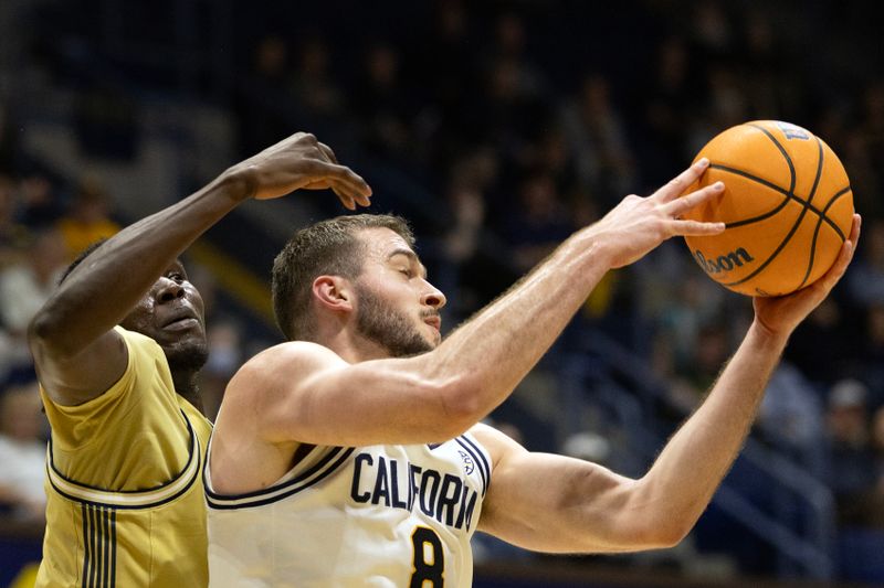 Feb 4, 2026; Berkeley, California, USA; California Golden Bears center Milos Ilić (8) rebounds in front of Georgia Tech Yellow Jackets forward Baye Ndongo (11) during the first half at Haas Pavilion. Mandatory Credit: D. Ross Cameron-Imagn Images