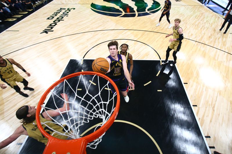 TORONTO, CANADA - APRIL 2: Austin Reaves #15 of the Los Angeles Lakers drives to the basket during the game against the Toronto Raptors on April 2, 2024 at the Scotiabank Arena in Toronto, Ontario, Canada.  NOTE TO USER: User expressly acknowledges and agrees that, by downloading and or using this Photograph, user is consenting to the terms and conditions of the Getty Images License Agreement.  Mandatory Copyright Notice: Copyright 2023 NBAE (Photo by Vaughn Ridley/NBAE via Getty Images)