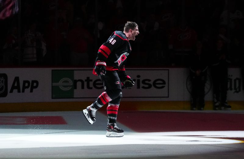 Apr 22, 2024; Raleigh, North Carolina, USA; Carolina Hurricanes left wing Jordan Martinook (48) celebrates their victory against the New York Islanders after game two of the first round of the 2024 Stanley Cup Playoffs at PNC Arena. Mandatory Credit: James Guillory-USA TODAY Sports