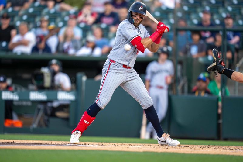 Jun 2, 2025; West Sacramento, California, USA; Minnesota Twins second baseman Kody Clemens (18) hit by a pitch during the second inning against the Athletics at Sutter Health Park. Mandatory Credit: Neville E. Guard-Imagn Images