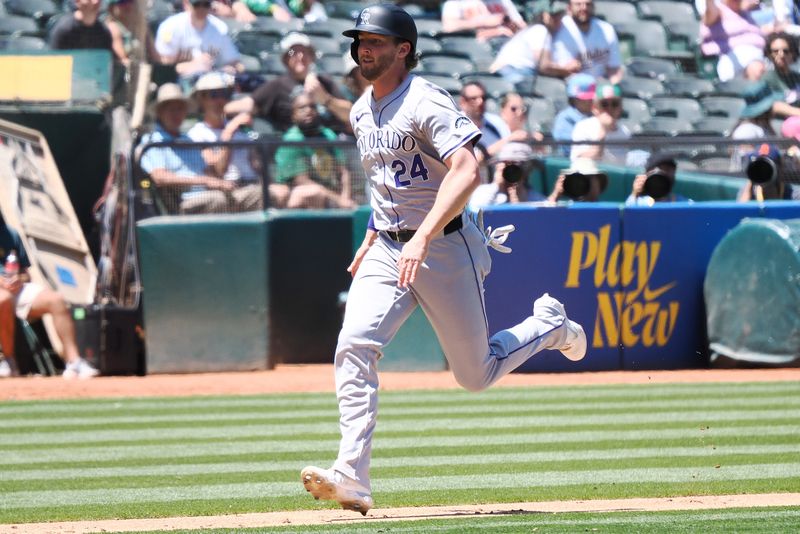 May 23, 2024; Oakland, California, USA; Colorado Rockies third baseman Ryan McMahon (24) scores a run against the Oakland Athletics during the sixth inning at Oakland-Alameda County Coliseum. Mandatory Credit: Kelley L Cox-USA TODAY Sports